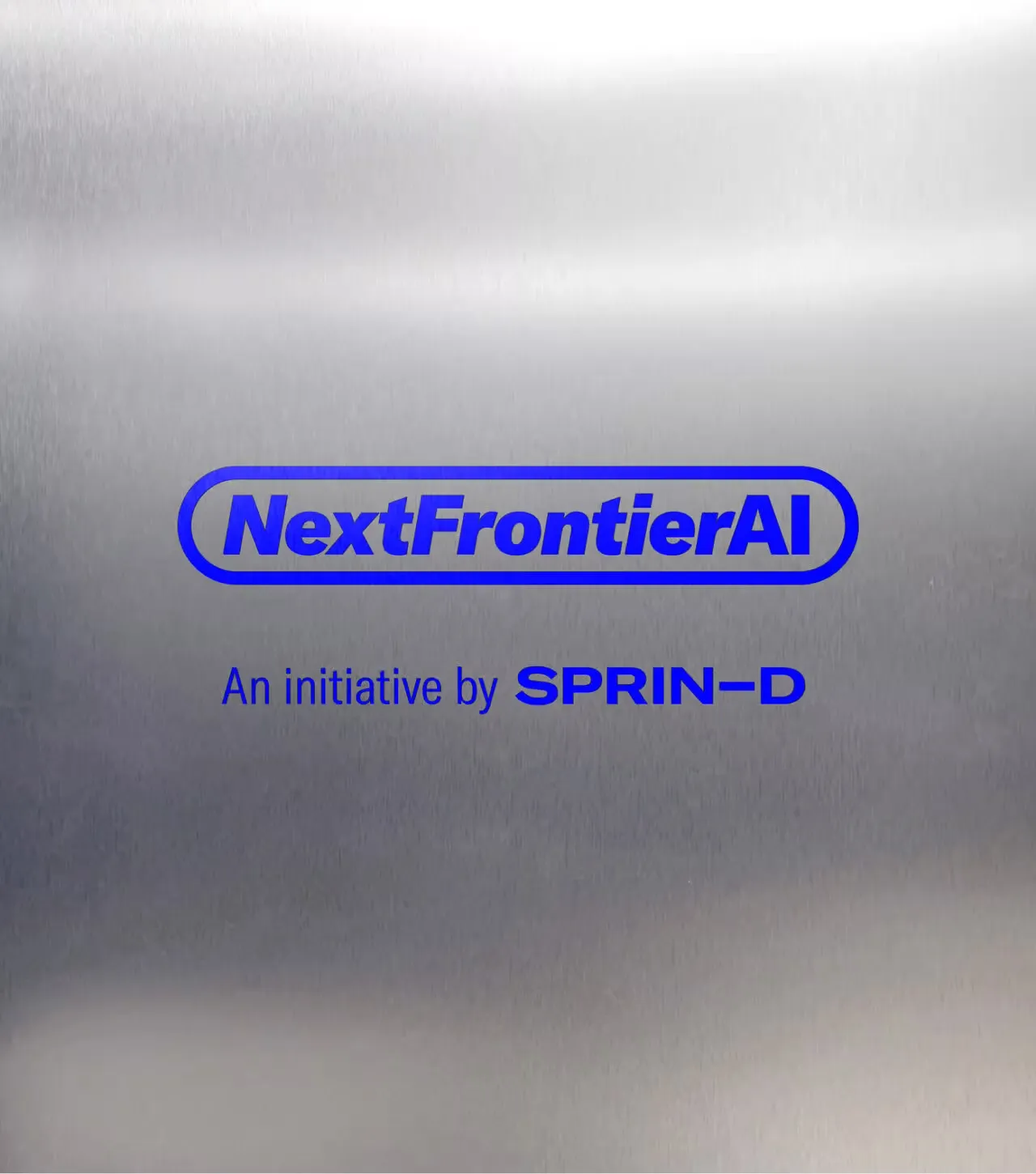 NextFrontierAI logo with tagline An initiative by SPRIN-D on brushed silver background